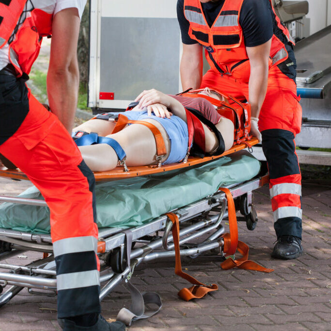 Woman after accident on the stretcher, horizontal